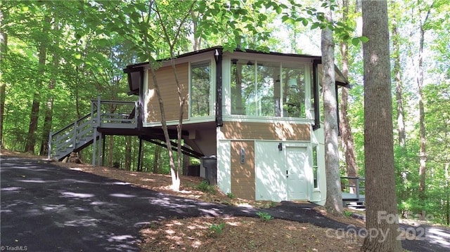 164 Johnson Ridge Rd, Elkin, NC 28621 - view of front of home with stairway, a sunroom, and a deck