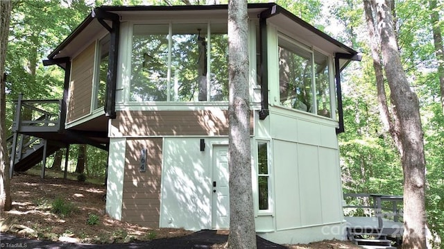 164 Johnson Ridge Rd, Elkin, NC 28621 - view of side of home with a sunroom, stairway, and a deck