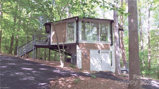 164 Johnson Ridge Rd, Elkin, NC 28621 - view of front of house with stairs, a sunroom, and a wooden deck
