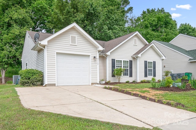 4719 Sahalee Ln, Charlotte, NC 28216 - ranch-style home with an attached garage, concrete driveway, and a front yard