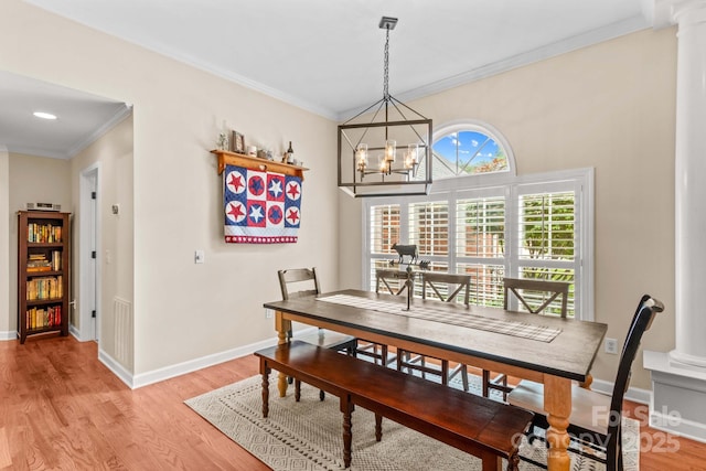 149 Harbor Landing Dr, Mooresville, NC 28117 - dining room with light wood-style floors, ornamental molding, baseboards, and a chandelier