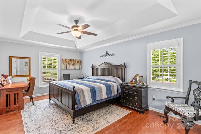 149 Harbor Landing Dr, Mooresville, NC 28117 - bedroom with a raised ceiling, wood finished floors, ornamental molding, baseboards, and ceiling fan