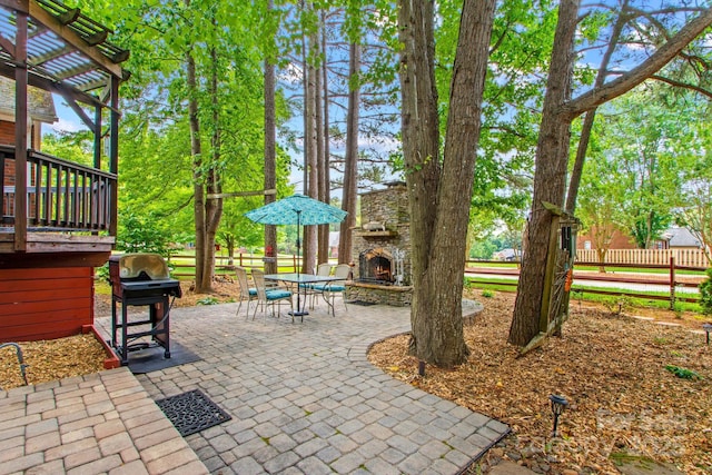 149 Harbor Landing Dr, Mooresville, NC 28117 - view of patio featuring an outdoor stone fireplace, a grill, and a pergola