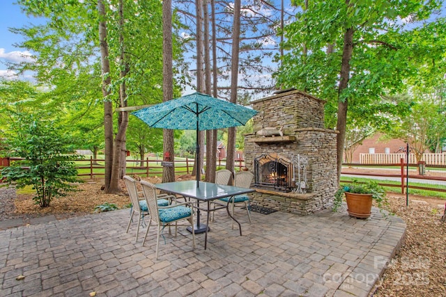 149 Harbor Landing Dr, Mooresville, NC 28117 - view of patio with an outdoor stone fireplace and outdoor dining space