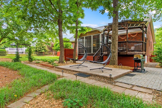 149 Harbor Landing Dr, Mooresville, NC 28117 - view of patio featuring a sunroom, grilling area, and a wooden deck
