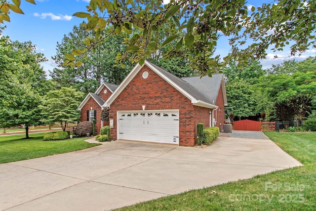 149 Harbor Landing Dr, Mooresville, NC 28117 - view of property exterior with brick siding, concrete driveway, an attached garage, and central AC