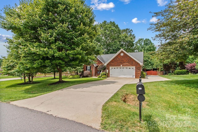 149 Harbor Landing Dr, Mooresville, NC 28117 - view of front of house with a front yard, brick siding, a garage, and concrete driveway