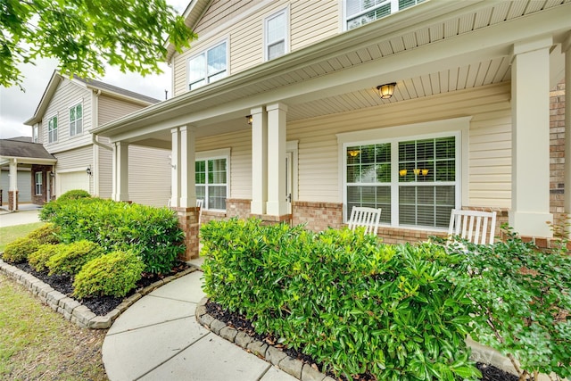 1412 Afternoon Sun Rd, Matthews, NC 28104 - entrance to property with covered porch, a garage, and brick siding