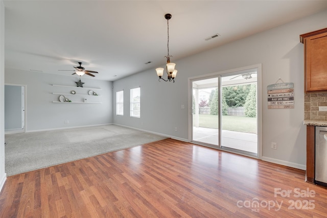 1412 Afternoon Sun Rd, Matthews, NC 28104 - unfurnished dining area with a chandelier, light wood finished floors, and a ceiling fan