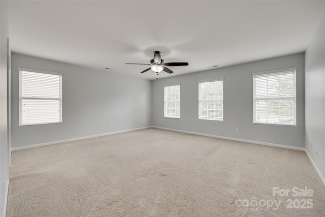 1412 Afternoon Sun Rd, Matthews, NC 28104 - spare room featuring a ceiling fan, plenty of natural light, and light carpet