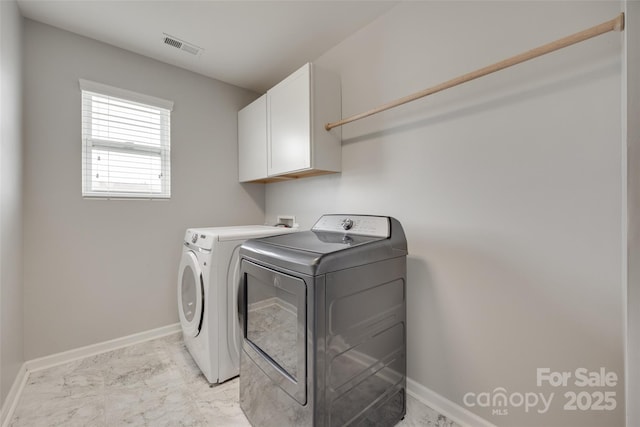 1412 Afternoon Sun Rd, Matthews, NC 28104 - washroom featuring cabinet space, washing machine and dryer, and light marble finish flooring