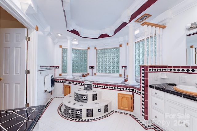 bathroom with ornate columns, tile patterned floors, ornamental molding, heating unit, and vanity
