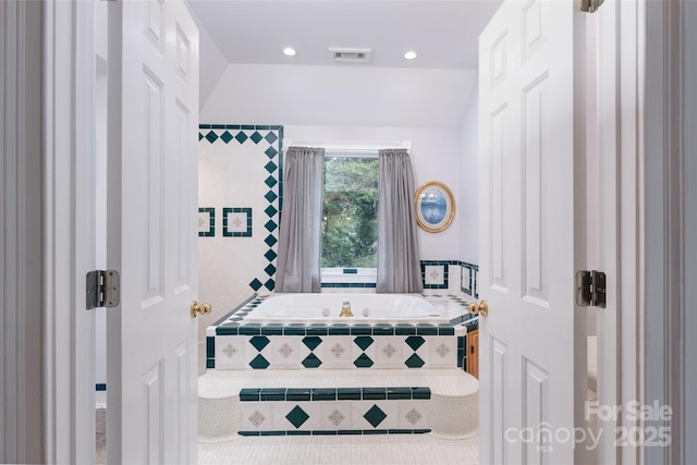 bathroom with a bath, tile patterned floors, and recessed lighting