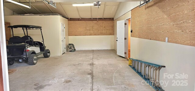 garage with wood walls
