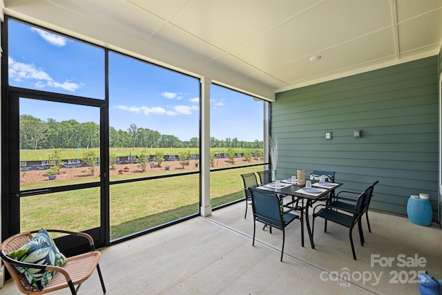 1133 Idyllic Ln, Waxhaw, NC 28173 - sunroom featuring outdoor dining space, a view of countryside, and view of scattered trees