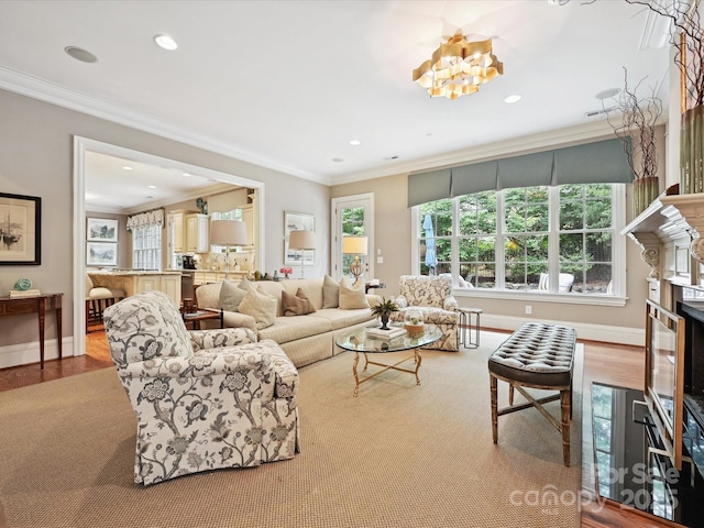 6128 Fletcher Cir, Charlotte, NC 28226 - living area with crown molding, wood finished floors, a chandelier, baseboards, and recessed lighting