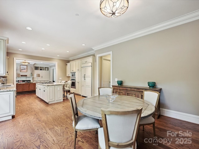 6128 Fletcher Cir, Charlotte, NC 28226 - dining space with ornamental molding, light wood-style floors, baseboards, and recessed lighting
