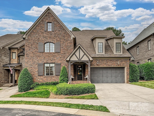 6128 Fletcher Cir, Charlotte, NC 28226 - view of front facade with brick siding, driveway, a garage, and roof with shingles
