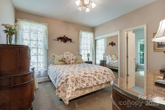 carpeted bedroom with a closet