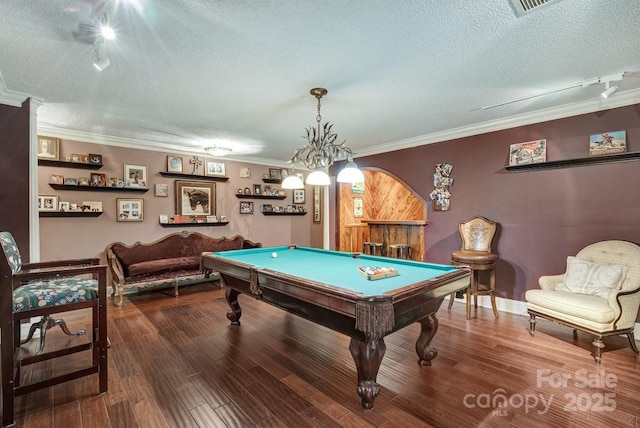 playroom with rail lighting, a textured ceiling, pool table, crown molding, and wood finished floors