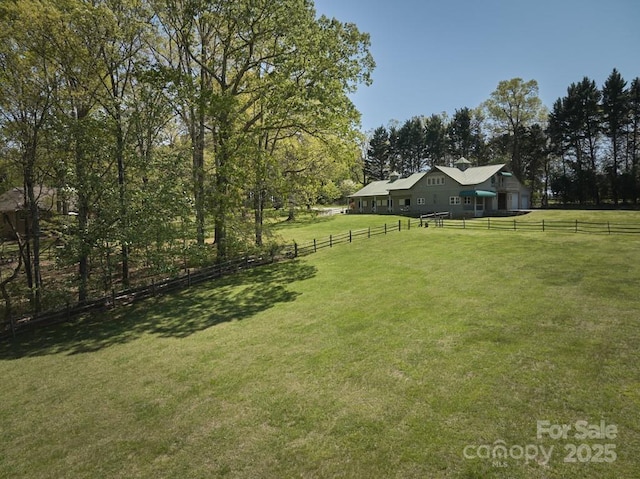 view of yard with a rural view