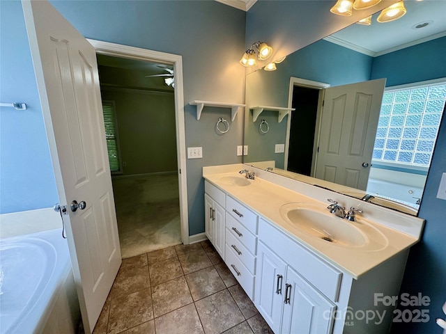 bathroom with ornamental molding, double vanity, tile patterned floors, baseboards, and a ceiling fan