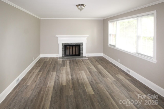 1421 Thompson Ave, Charlotte, NC 28216 - unfurnished living room featuring dark wood finished floors, a stone fireplace, and crown molding