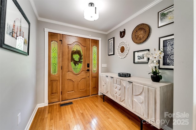 3407 Patton Rd, Franklin, NC 28734 - entryway with light wood-style floors, ornamental molding, and baseboards