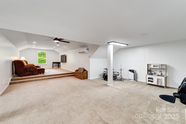 3407 Patton Rd, Franklin, NC 28734 - workout area with vaulted ceiling, light colored carpet, an AC wall unit, and baseboards