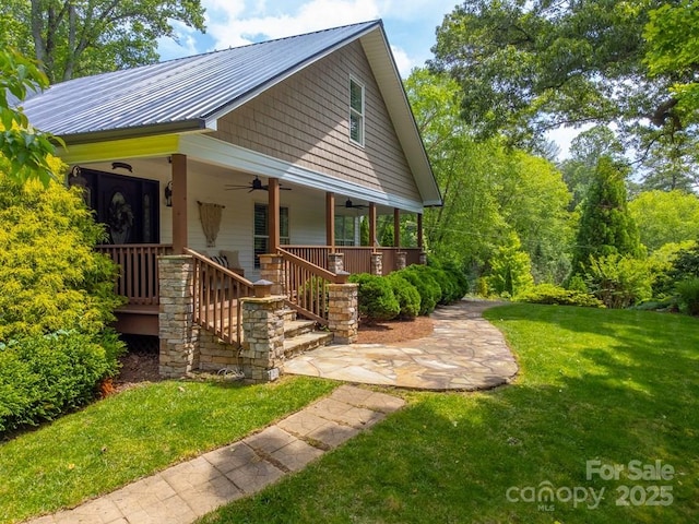 3407 Patton Rd, Franklin, NC 28734 - view of front of house with a ceiling fan, a front yard, covered porch, and metal roof