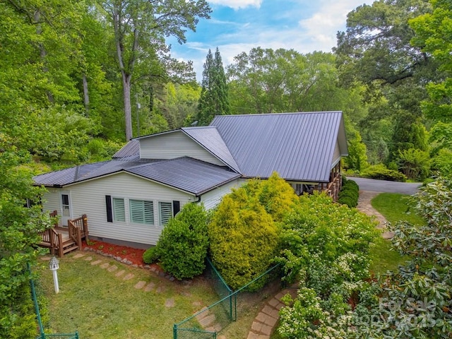 3407 Patton Rd, Franklin, NC 28734 - view of property exterior with metal roof and a wooden deck