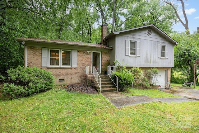 tri-level home with brick siding, a chimney, an attached garage, concrete driveway, and a front lawn