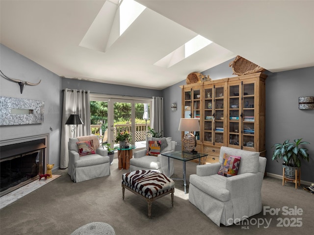 118 Cloverleaf Ln, Asheville, NC 28803 - carpeted living room featuring a skylight and a fireplace with flush hearth
