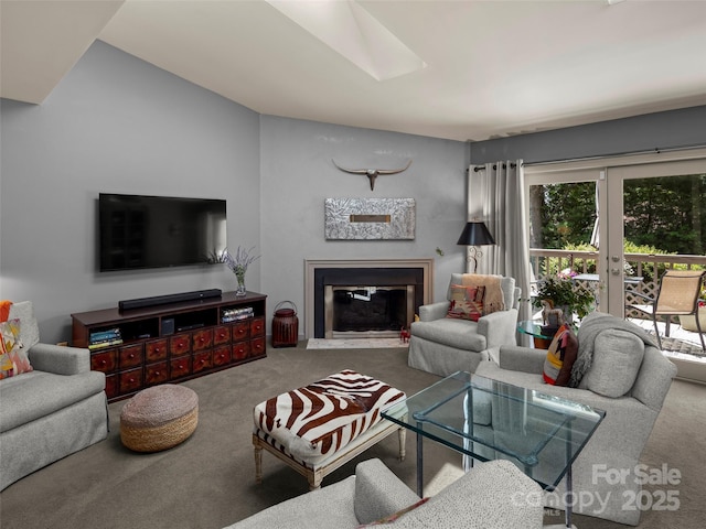 118 Cloverleaf Ln, Asheville, NC 28803 - carpeted living room featuring a skylight and a fireplace with flush hearth