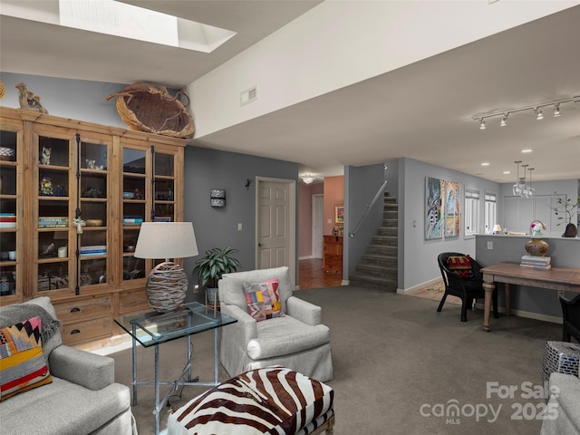 118 Cloverleaf Ln, Asheville, NC 28803 - living area with stairs, a skylight, carpet floors, and baseboards