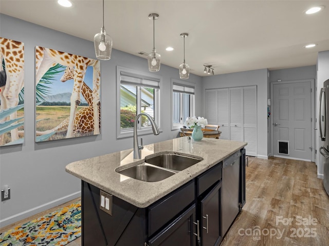 118 Cloverleaf Ln, Asheville, NC 28803 - kitchen featuring a sink, stainless steel appliances, a kitchen island with sink, baseboards, and recessed lighting