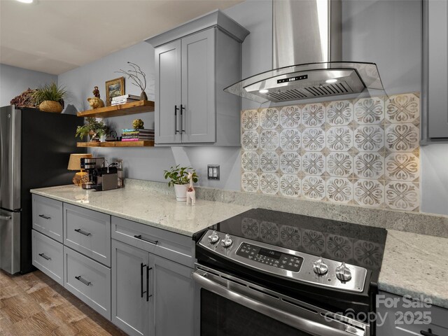 118 Cloverleaf Ln, Asheville, NC 28803 - kitchen featuring appliances with stainless steel finishes, extractor fan, gray cabinetry, light stone counters, and open shelves