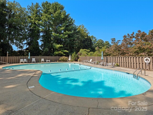 118 Cloverleaf Ln, Asheville, NC 28803 - community pool featuring fence, a patio, and view of scattered trees