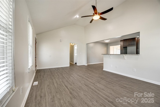 752 Chipmeadow Ln, York, SC 29745 - unfurnished living room with a ceiling fan, dark wood-style flooring, baseboards, and high vaulted ceiling