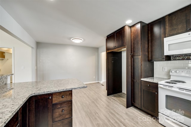 752 Chipmeadow Ln, York, SC 29745 - kitchen featuring white appliances, light wood-style flooring, decorative backsplash, dark brown cabinets, and recessed lighting