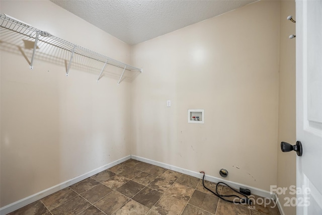 752 Chipmeadow Ln, York, SC 29745 - washroom with washer hookup, baseboards, dark stone finish floors, and a textured ceiling