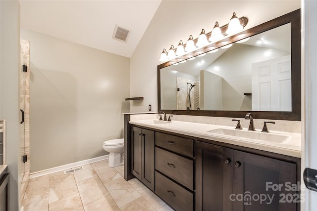 752 Chipmeadow Ln, York, SC 29745 - bathroom with vaulted ceiling, a shower stall, double vanity, toilet, and baseboards
