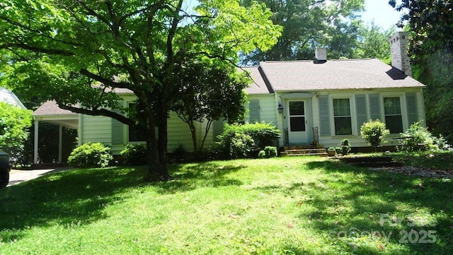view of front of house with a front lawn and a chimney