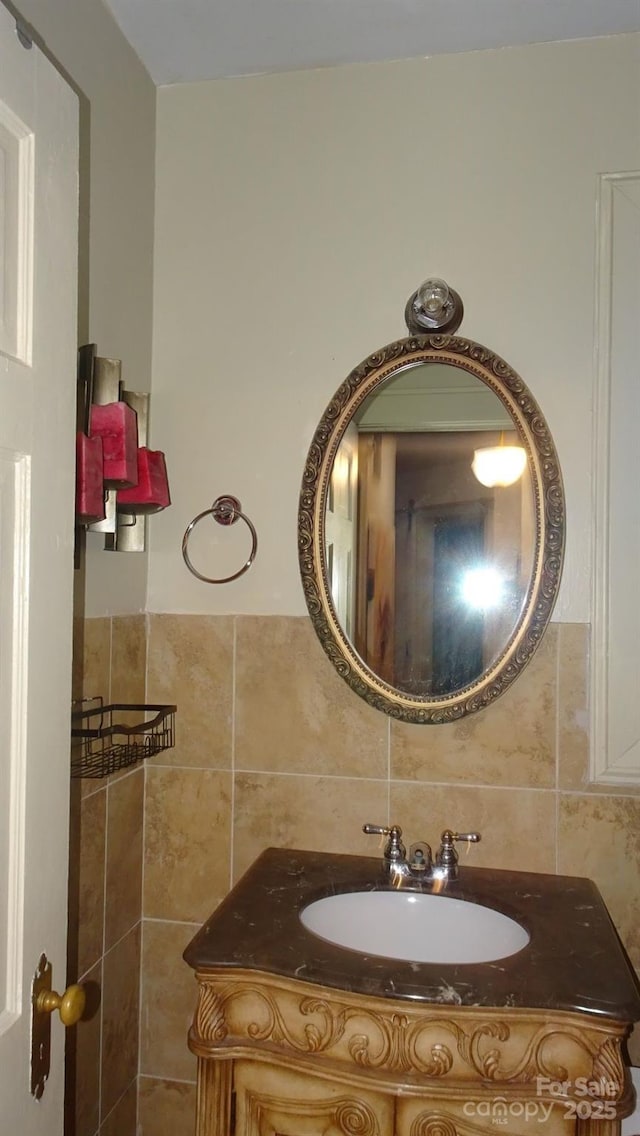 bathroom with tile walls, backsplash, and vanity
