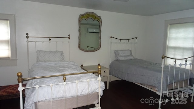 bedroom with a wall mounted air conditioner