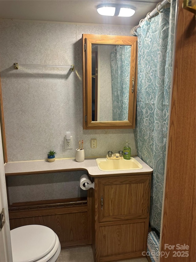 full bathroom with vanity and toilet