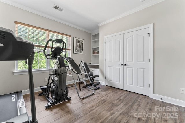 1016 Spanish Moss Rd, Indian Trail, NC 28079 - workout area featuring wood finished floors, crown molding, and baseboards