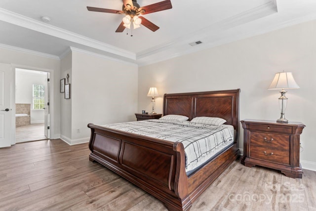 1016 Spanish Moss Rd, Indian Trail, NC 28079 - bedroom with light wood-style flooring, crown molding, baseboards, ensuite bath, and ceiling fan