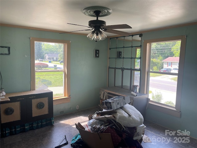sitting room featuring a ceiling fan