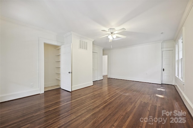 unfurnished living room featuring ceiling fan, dark wood finished floors, baseboards, and ornamental molding